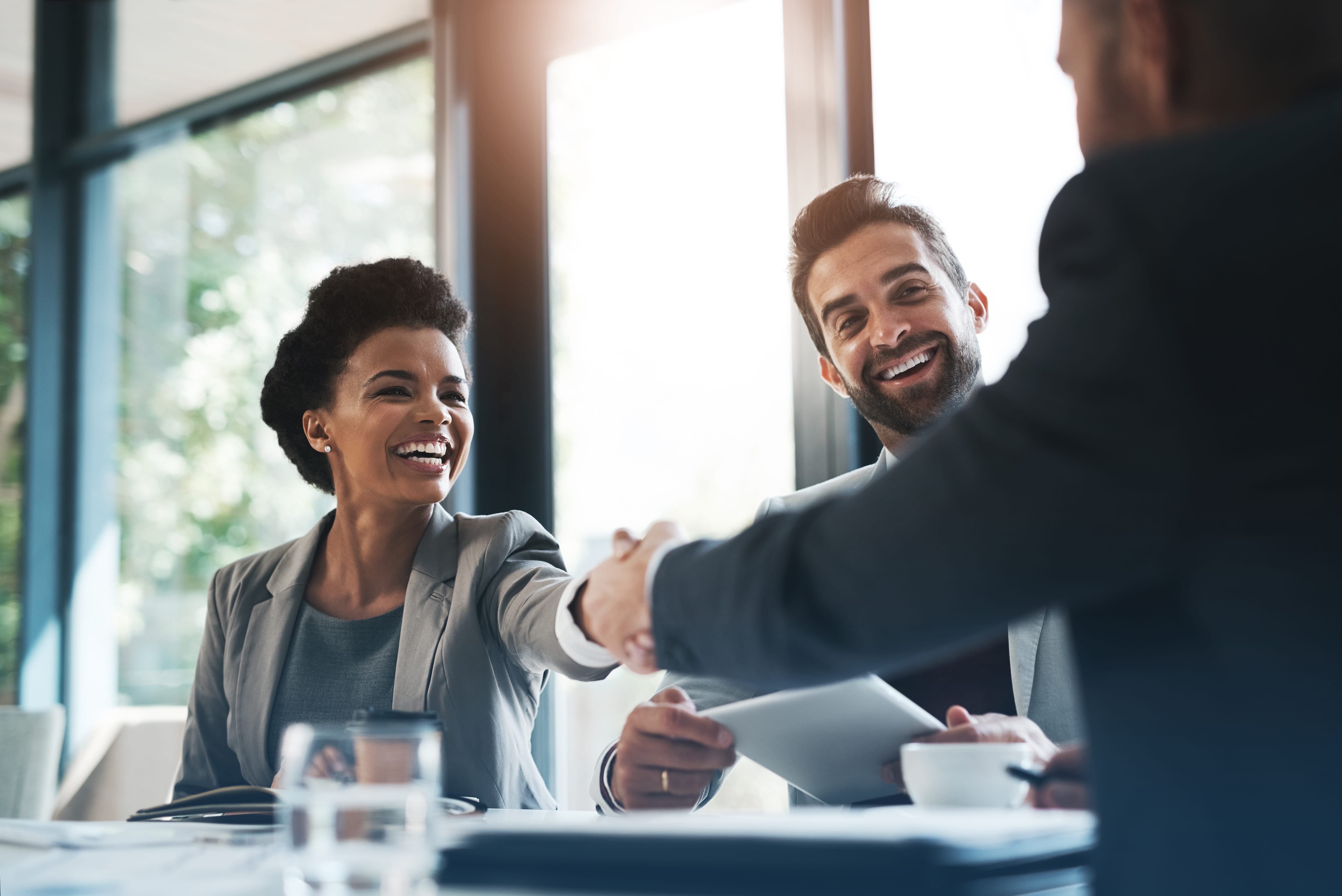 business people, handshake and meeting in teamwork for partnership-flipped